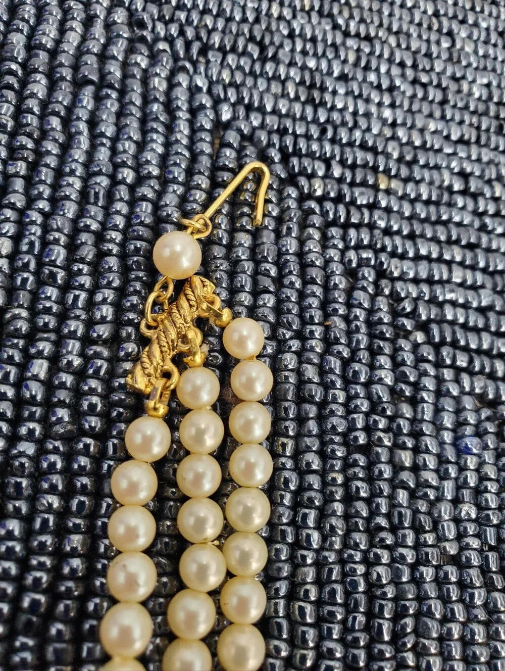 Vintage-style 3-strand pearl choker necklace with a prominent cameo centerpiece